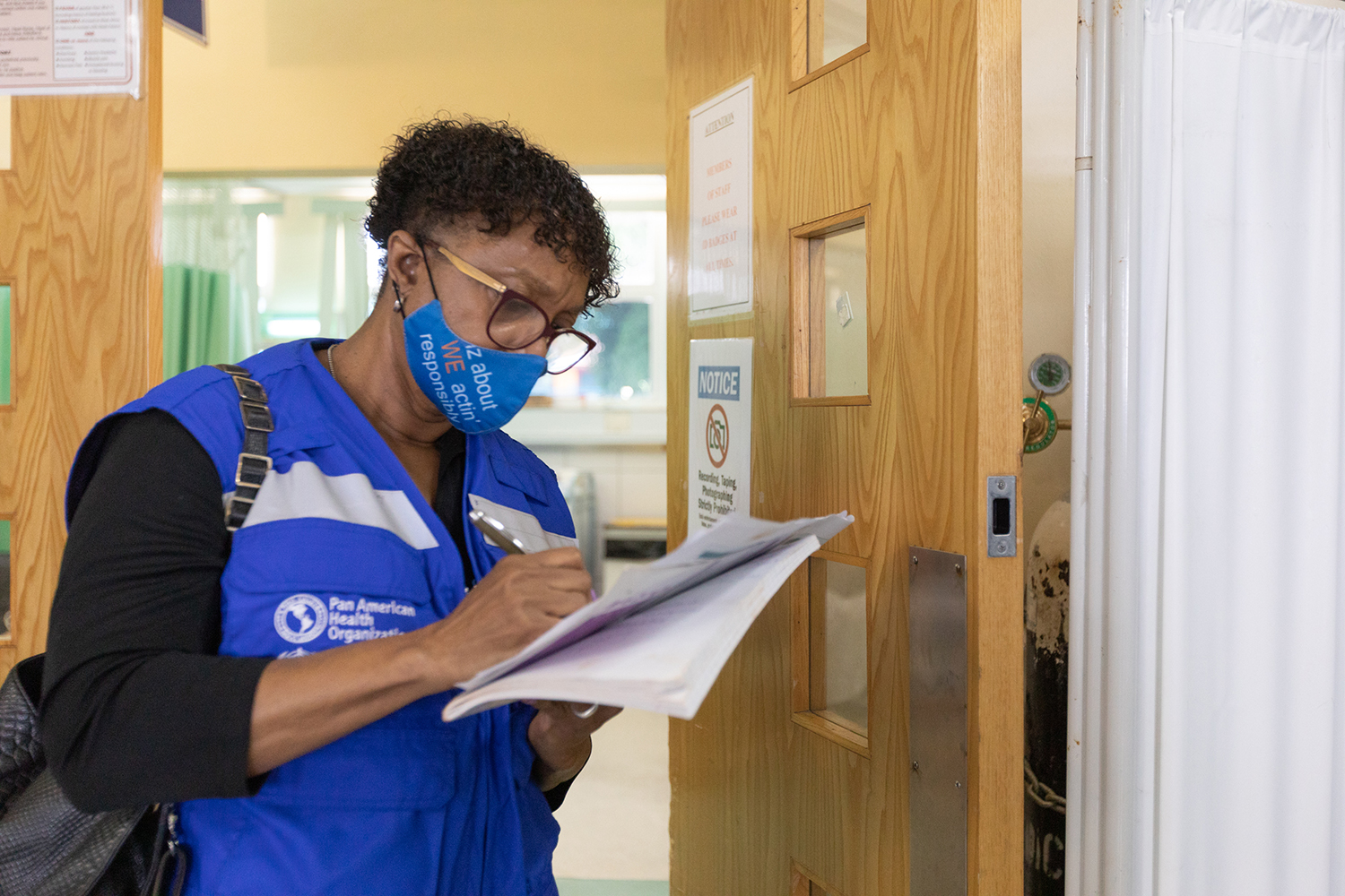 PAHO/WHO Representative Dr Erica Wheeler takes notes while observing a simulation exercise.