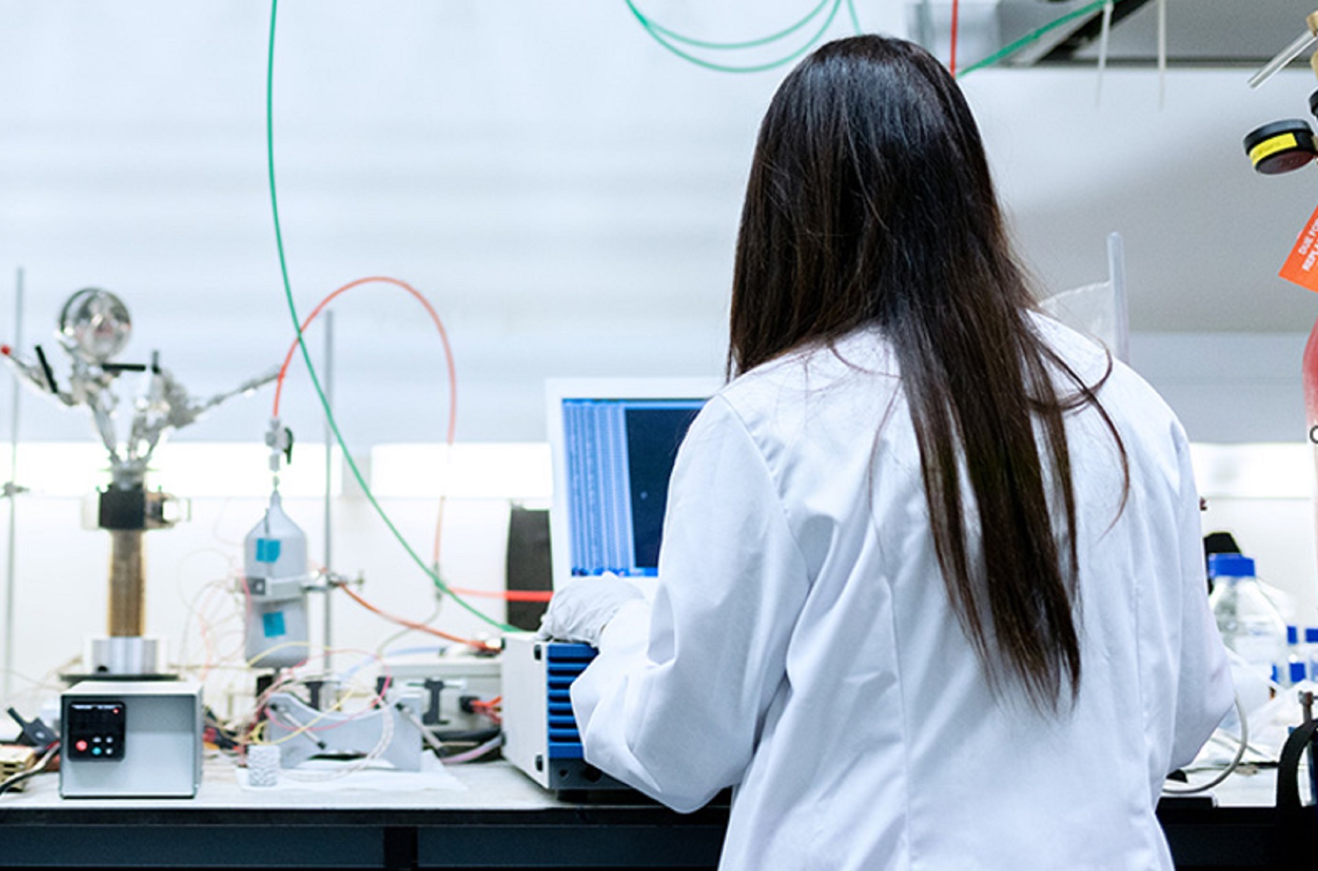 Working in a lab black hair woman working in a lab
