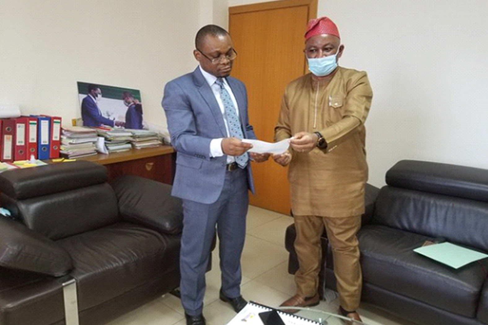 WHO country representative, Dr George Fom Ameh, transmitting an official letter acknowledging this achievement to Equatorial Guinea’s Minister of Health, Dr Diosdado Vicente Nsue Milang