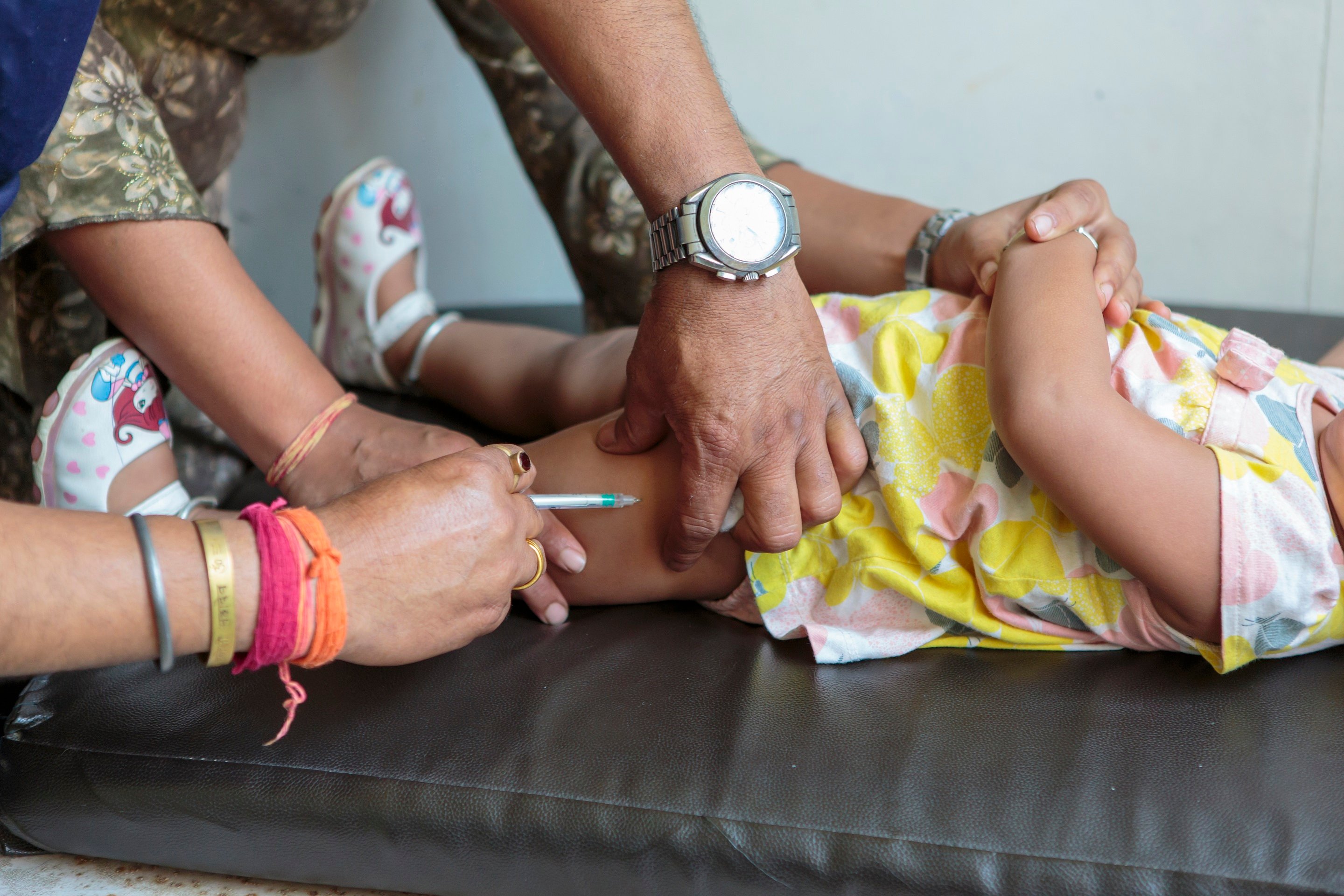 A 15-month girl receives measles-rubella vaccine at Patan Hospital, Lalitpur, Nepal