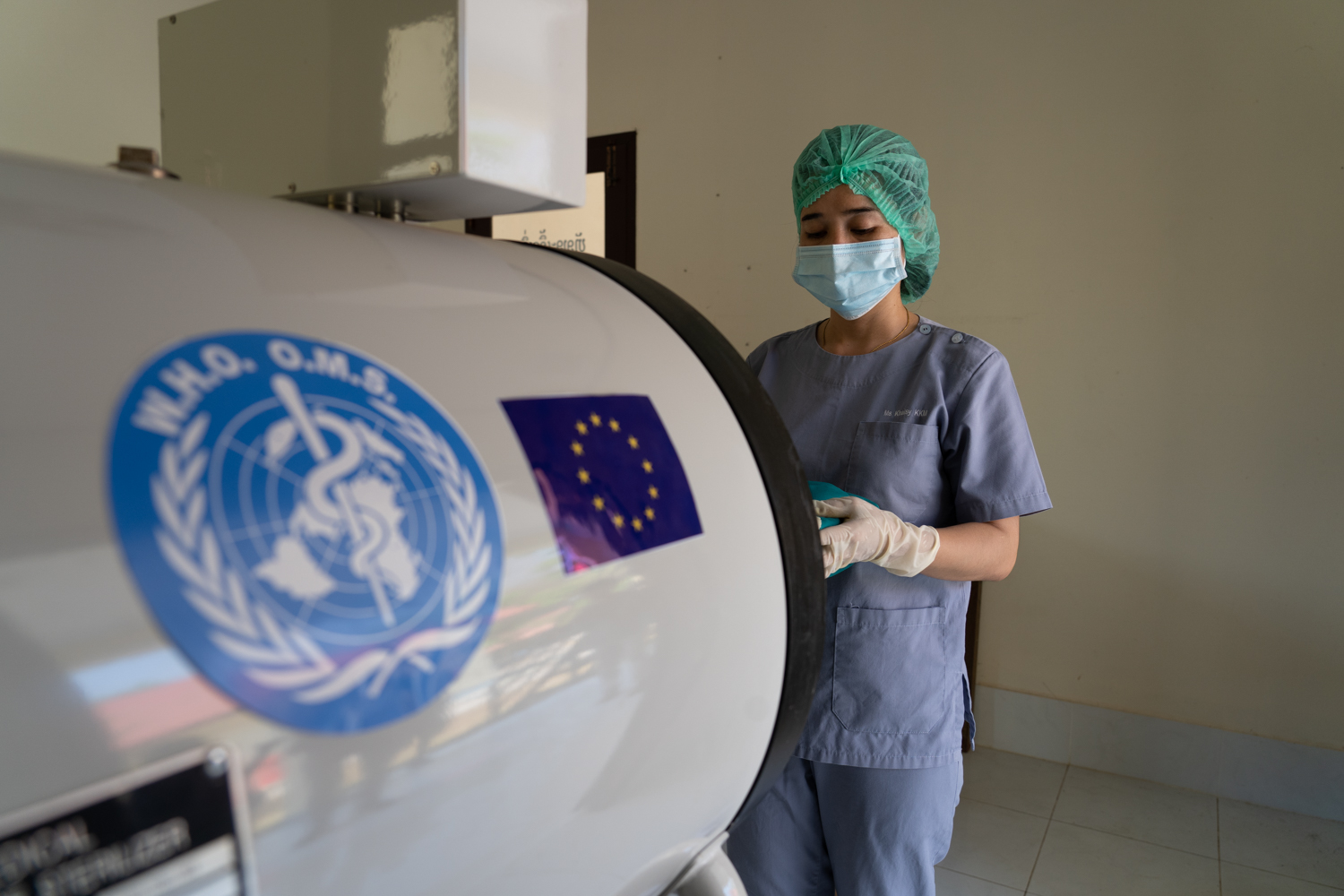 Nurse putting medical equipment in an autoclave